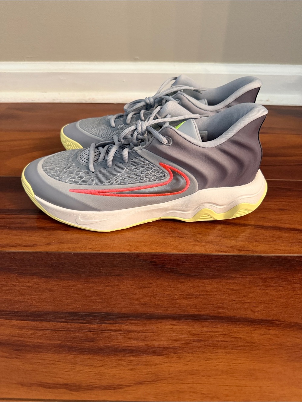 Nike Giannis Immortality 4 Basketball Gray with Coral Swoosh and Yellow Outsole
